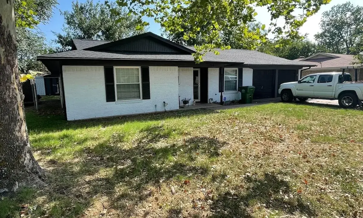 Professional roofing crew working on a residential roof in Absecon